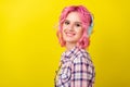 Profile photo of nice pink hairdo young lady hear music wear plaid shirt isolated on yellow color background