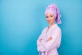 Profile photo of pretty young lady folded arms look camera empty space wear violet towel turban bathrobe isolated blue Royalty Free Stock Photo