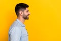 Profile photo of young successful guy influencer smiling look empty space got good profit isolated on yellow color