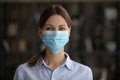 Profile picture of Caucasian woman in facemask from coronavirus