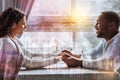 Profile of pleasant couple sitting in front of each other