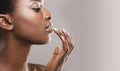 Profile portrait of beautiful african american girl touching her lips Royalty Free Stock Photo