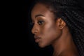 profile portrait of beautiful african american woman with water drops on face looking away Royalty Free Stock Photo