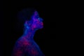 Profile portrait of a beautiful girl alien. Ultraviolet body art aquamarine night sky with stars and pink jellyfish Royalty Free Stock Photo
