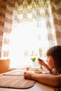 Profile portrait of beautiful young girl eating cheesecakes. Vertical image Royalty Free Stock Photo