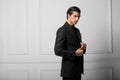 Closeup portrait of a confident business man in black suit with red silk scarf in pocket, over white background Royalty Free Stock Photo