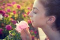 Profile portrait girl smelling a rose flower Royalty Free Stock Photo