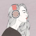 Profile portrait of gorgeous long-haired young woman with closed eyes wearing headphones. Beautiful girl or lady