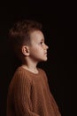 Profile portrait of serious sad white Caucasian child preschooler kid boy Royalty Free Stock Photo