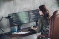 Profile portrait of smart cybersecurity expert girl sitting leather chair keyboard typing open space indoors Royalty Free Stock Photo