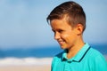 Profile portrait of a smiling boy on the sea beah Royalty Free Stock Photo