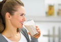 Profile portrait of woman drinking fresh smoothie