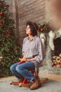 Profile portrait of woman on wooden rocking horse Royalty Free Stock Photo