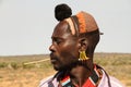 Profile portrait of a young male of the hamer ethnicity in Turmi