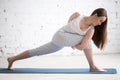 Profile portrait of young woman doing Revolved Side Angle Pose Royalty Free Stock Photo