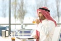 Arab man smelling tea in a coffee shop