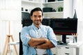Profile smart IT developer looking camera against on coding pc screen. Surmise.
