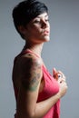 Profile of a short-hair brunette woman, wearing a red tank top h Royalty Free Stock Photo