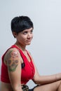 Profile of a short-hair brunette woman wearing a red tank top Royalty Free Stock Photo