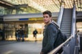 Profile shot of handsome young man inside train