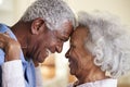 Profile Shot Loving Senior Couple Head To Head At Home Together