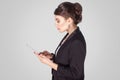 Profile side businesswoman , holding smart phone, sending sms Royalty Free Stock Photo