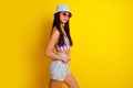 Profile side image of sexy slim girl wear bikini crop top enjoying summer holidays isolated on yellow color background Royalty Free Stock Photo