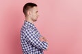 Profile side photo of attractive young man crossed arms confident look empty space isolated on pink color background Royalty Free Stock Photo