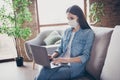 Profile side photo of focused girl manager corona virus infection patient quarantine work home use laptop read document