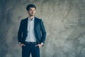 Profile side photo of good looking freelancer rich wealthy company owner put hands in pockets of his stylish pants Royalty Free Stock Photo