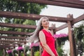 Profile side photo of mature attractive asian woman happy positive smile fly air hair nature summer walk park outdoors Royalty Free Stock Photo