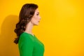 Profile side photo of serious adorable girl wear stylish outfit presenting new hairdress empty space  on yellow Royalty Free Stock Photo