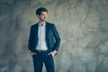 Profile side photo of virile good looking freelancer rich wealthy banker put his hands in pockets of expensive trousers Royalty Free Stock Photo