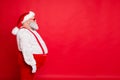 Profile side photo of white gray hair fat overweight santa claus with big funny belly abdomen ready for new year Royalty Free Stock Photo