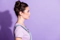 Profile side photo of young attractive girl serious confident look empty space isolated over purple color background