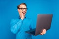 Profile side photo of young business man amazed shocked surprised look laptop news isolated over blue color background Royalty Free Stock Photo