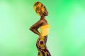 Profile side photo of young dark skin lady look empty space glamour outfit isolated on vivid green color background