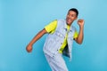 Profile side photo of young excited african guy good mood dancer clubber isolated over blue color background