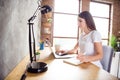 Profile side photo of young girl happy positive smile look laptop write notes to-do list remote work indoors Royalty Free Stock Photo