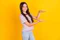 Profile side photo of young girl happy smile show hands little small size isolated over yellow color background