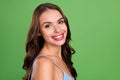 Profile side photo of young woman happy positive smile skincare hydration beauty isolated over green color background Royalty Free Stock Photo