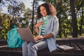 Profile side photo of youth african lady speak video seminar hand on chest comedy humor laugh outdoors Royalty Free Stock Photo