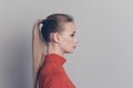 Profile side view close-up portrait of her she nice-looking lovely sweet adorable winsome attractive calm girl in red Royalty Free Stock Photo