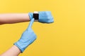 Profile side view closeup of human hand in blue surgical gloves holding and showing wirst smart watch and pointing at empty screen Royalty Free Stock Photo