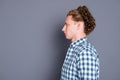 Profile side view of content young man with wavy hair in casual