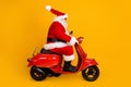 Profile side view of his he nice funny fat thick white-haired Santa riding motor bike fast speed hurry up rush shopping