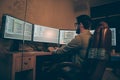 Profile side view of his he nice senior devops expert guy sitting in chair solving tech problem coding mysql html php