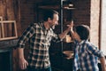 Profile side view photo of charming delighted dad kid have aims champion craft occupation great deal scream shout yeah Royalty Free Stock Photo