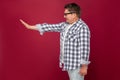 Profile side view portrait of angry handsome middle aged business man in casual checkered shirt and eyeglasses standing and Royalty Free Stock Photo