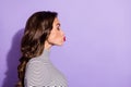 Profile side view portrait of attractive amorous wavy-haired girl sending air kiss copy space isolated over bright Royalty Free Stock Photo